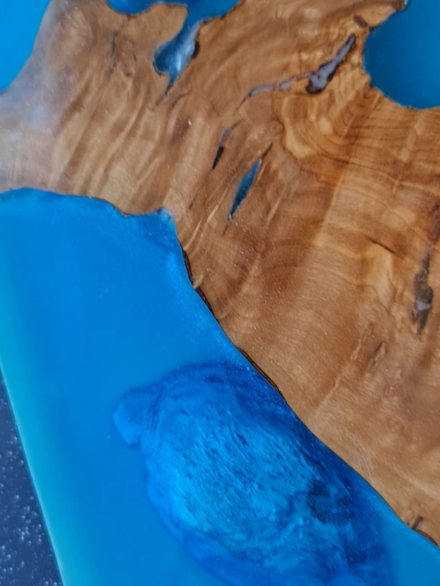 Lunar Drift longboard glowing blue resin with natural wood islands