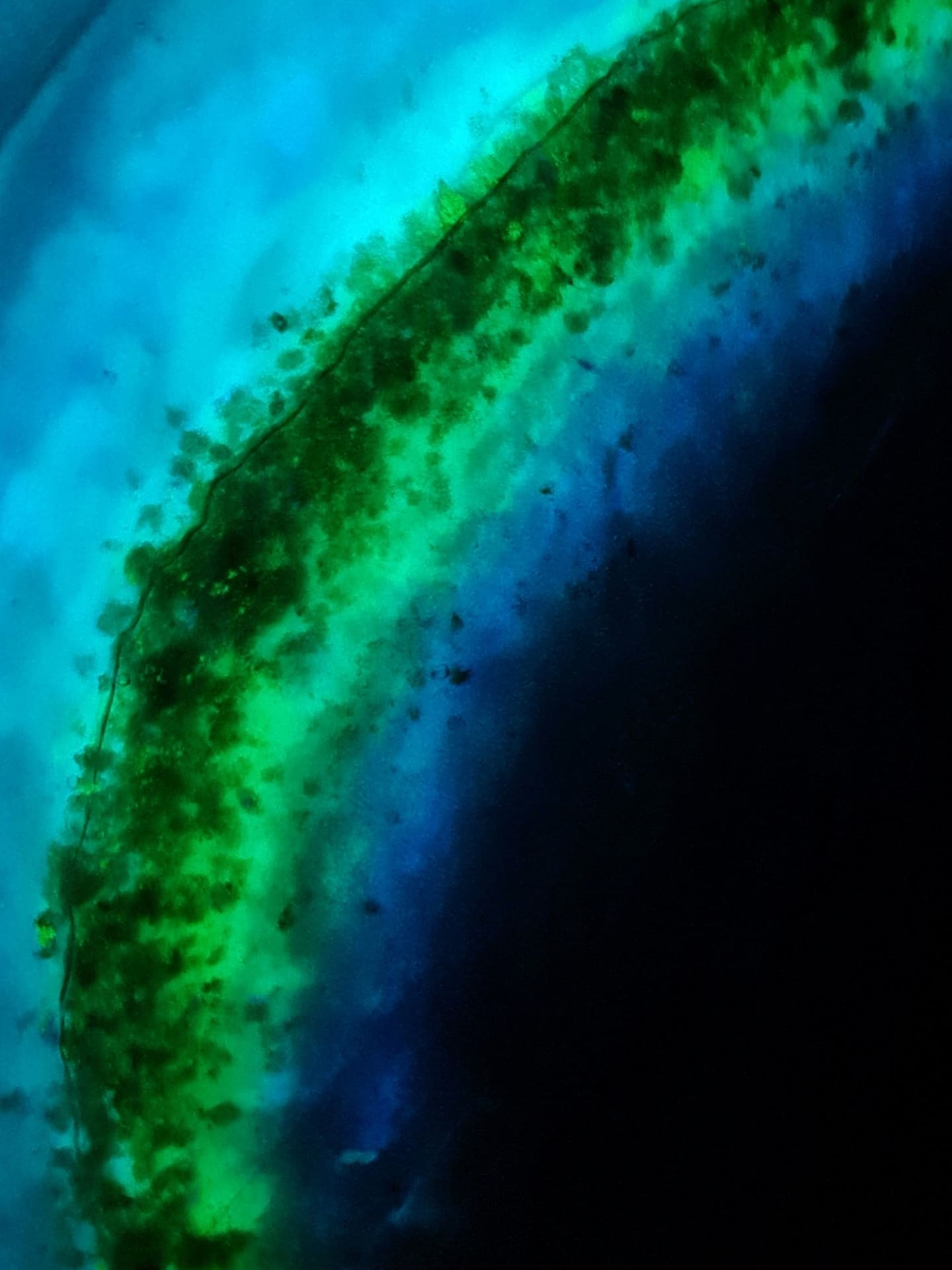 Glow Tide 40 cm round side table with cyan and green phosphorescent resin glowing in the dark — view 2