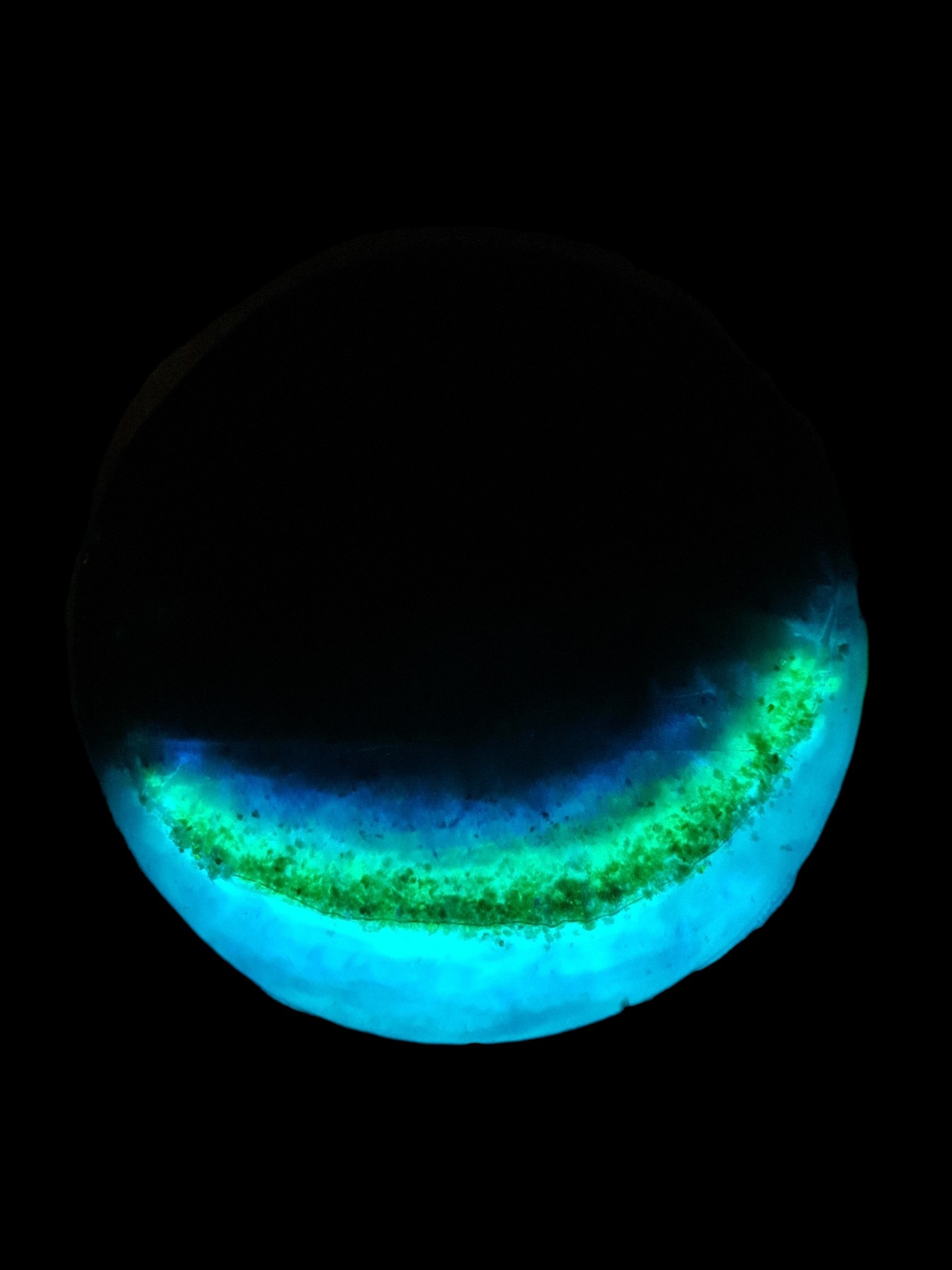 Glow Tide 40 cm round side table with cyan and green phosphorescent resin glowing in the dark — view 3