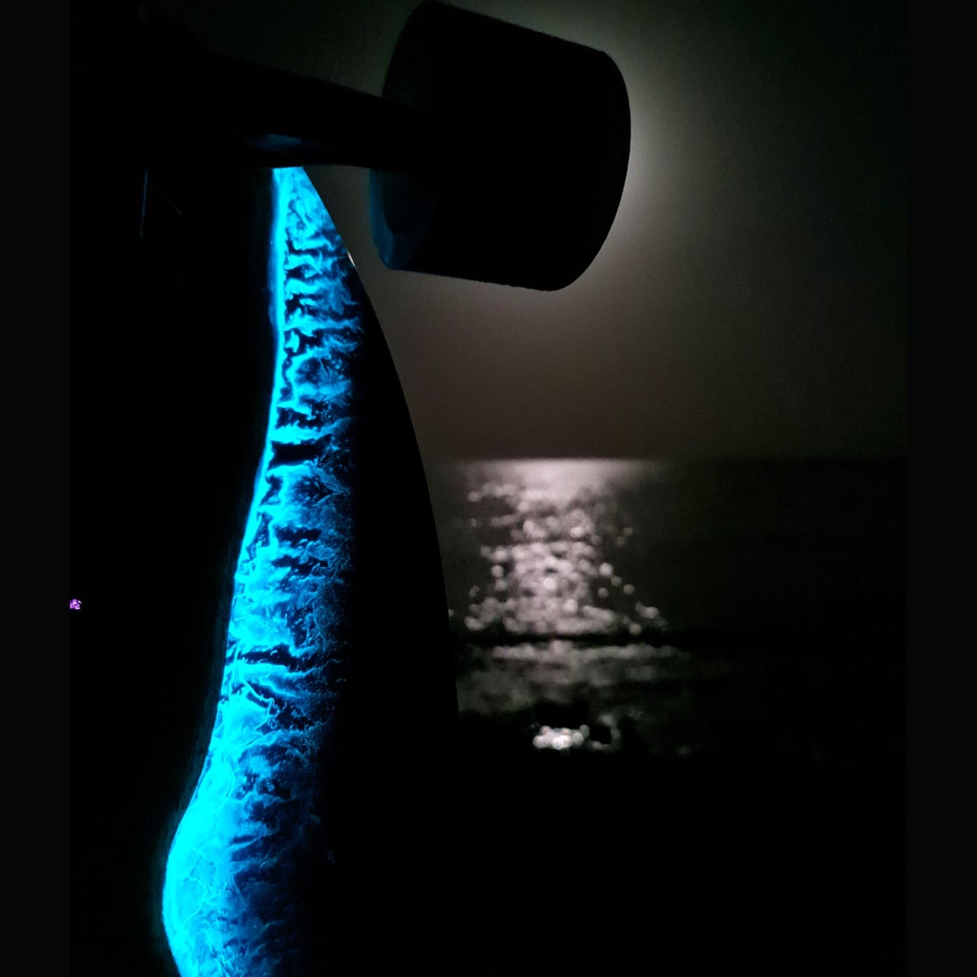 Noctiluca Wave handmade longboard with glowing cyan resin inspired by sea waves at night — view 2