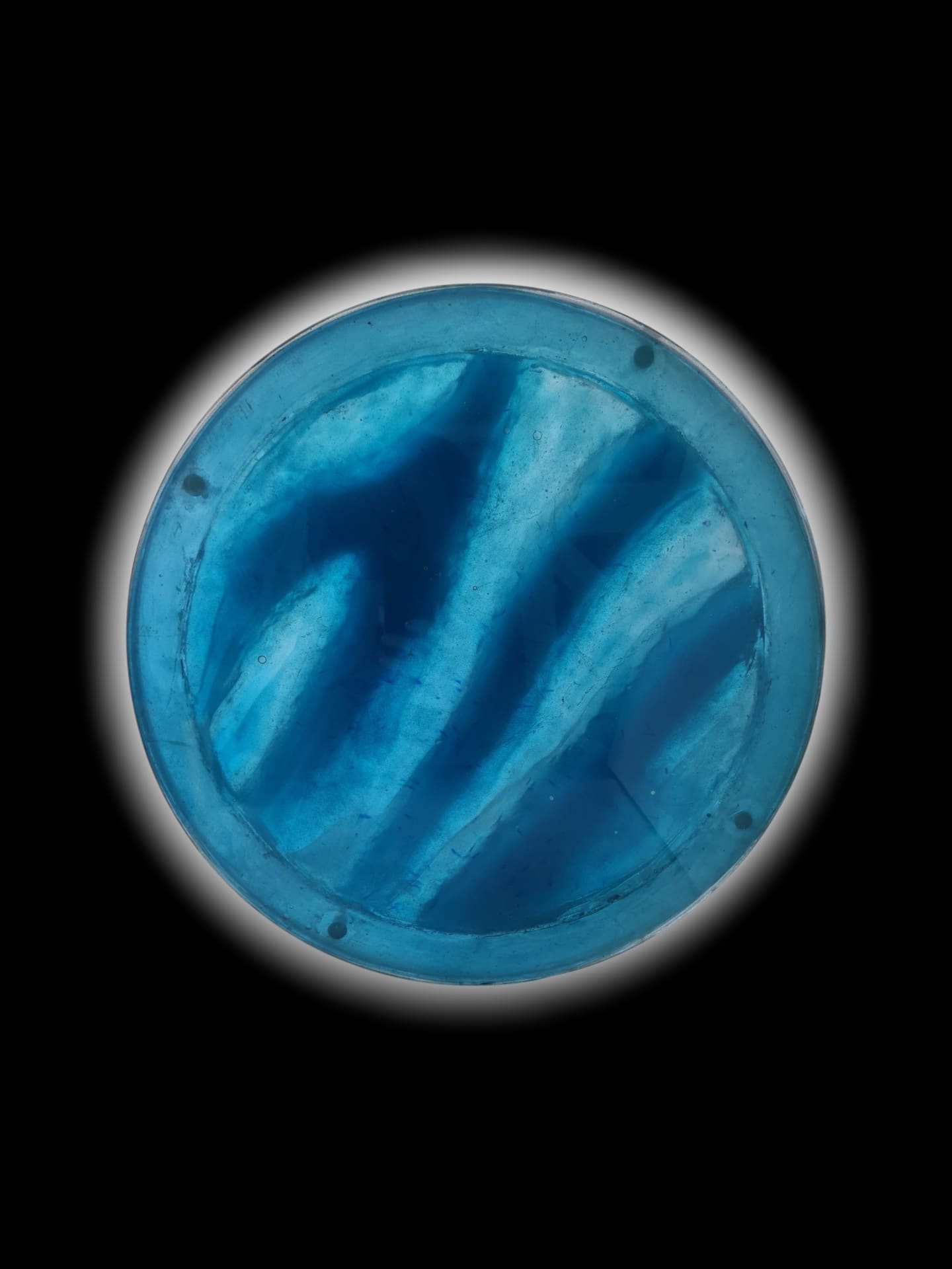 Tidal Veil round resin table with flowing blue wave design that shifts color in the light — view 1
